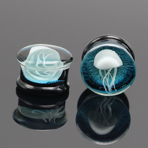 Jellyfish Glass Plugs. Ear Gauges With White Jellyfish And Blue Background. Free Shipping To Your Doorstep. Checked For Flaws.