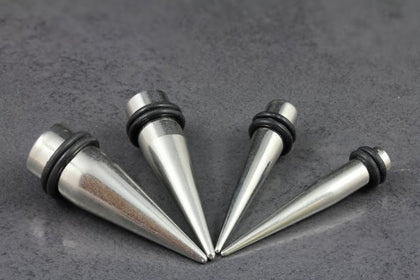 Ear tapers and stretchers. Stainless steel tapers, acrylic tapers, wooden tapers.