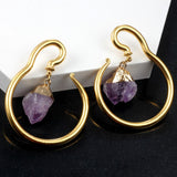 Purple ston ear hangets for stretched lobes.