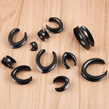 Saddle ear tunnels with free shipping. Black triangular ear tunnels 6mm to 30mm, sold as pairs.