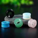 Natural stone ear tunnels with free shipping to your doorstep. Available in five colors. Checked for flaws and sold as pairs. Ear lobe gauges.