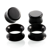 Black silicone tunnels and black stone gauges.