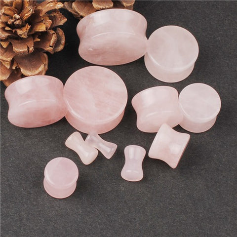 Pink stone ear plug gauges with free shipping to your doorstep. Ear lobe plugs made from natural stone. Our plugs are sold as pairs and checked for flaws.
