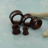 Wooden saddle ear tunnels with free worldwide shipping. Ear tunnels sold as pairs and checked for flaws.