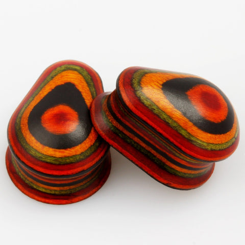 Vintage oval wooden ear plugs with free worldwide shipping. Ear plug gauges for ear stretching. Sold as pair and checked for flaws.