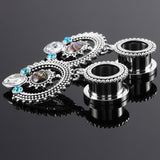Round dangle ear tunnel gauges with free shipping to your doorstep. Our tunnels are sold as pairs and checked for flaws. Made with high quality materials.