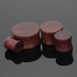 Pair of wooden saddle ear plugs with free worldwide shipping to your doorstep. Plugs and tunnels made of natural wood.